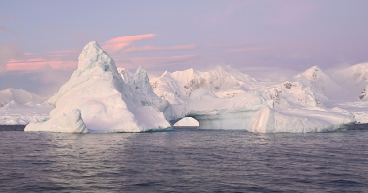 An arched iceberg along the Antarctic Peninsula, taken June 17, 2022. Last month Antarctic sea ice extent reached a record low for June, at 4.68 million square miles — or about 471,000 square miles below average. (Dan Costa/National Science Foundation/Creative Commons: https://creativecommons.org/licenses/by-nc-nd/4.0/)